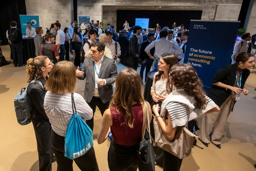 students and a company representative engaged in a discussion during a career fair