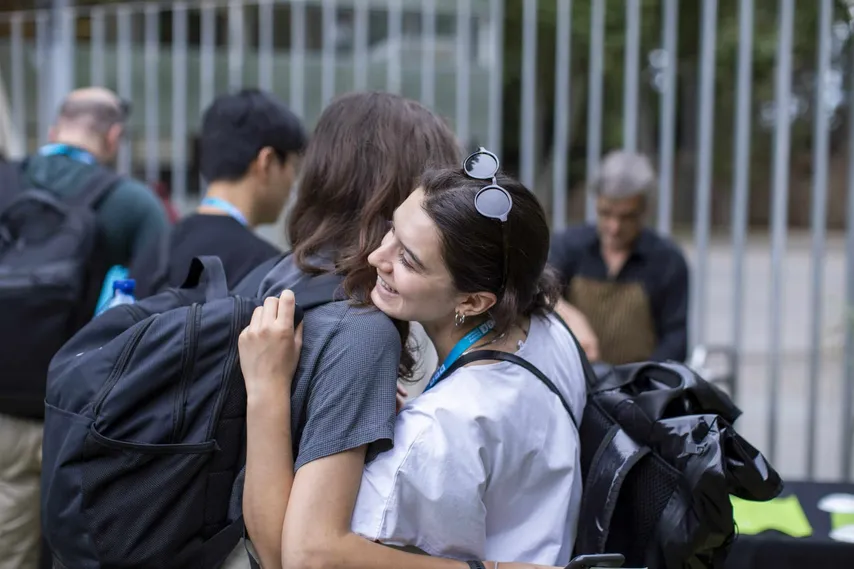 Two BSE Summer School participants hugging