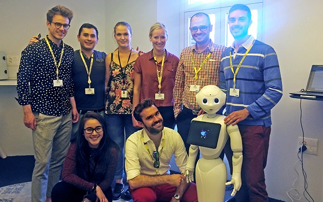 BSE Data Science students with robot at Accenture Innovation Center