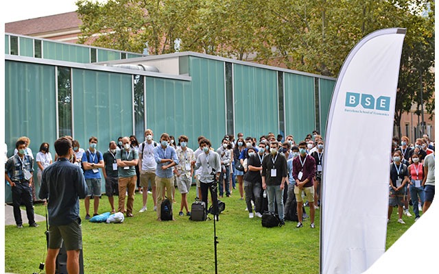 Students attend the welcome session outdoors with masks and social distancing for Covid-19 safety